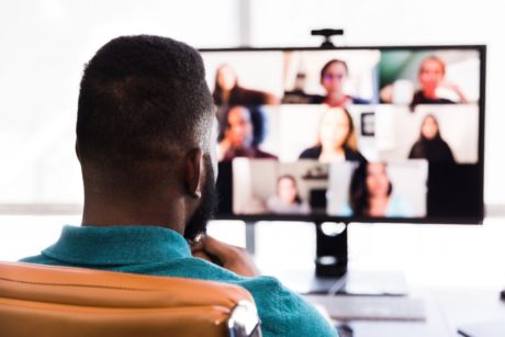 Man having a virtual team meeting