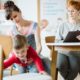 mother in denim jumpsuit helping son with adhd