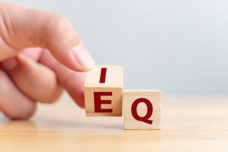 wooden letter cubes showing the words iq and eq