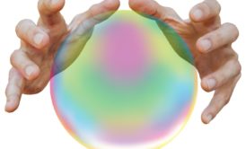 male hands on a crystal ball