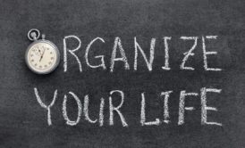 organize your life written in white chalk