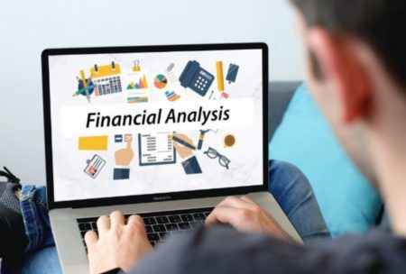 laptop showing words financial analysis on display