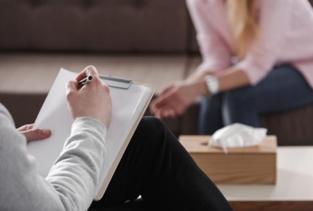 counselor talking to client in office