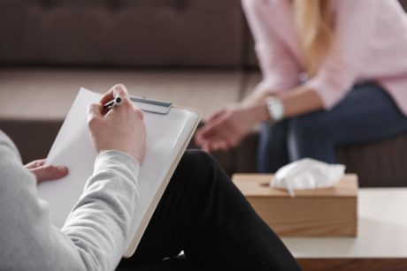 counselor talking to client in office