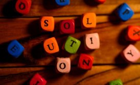 letter blocks spelling out the word solution
