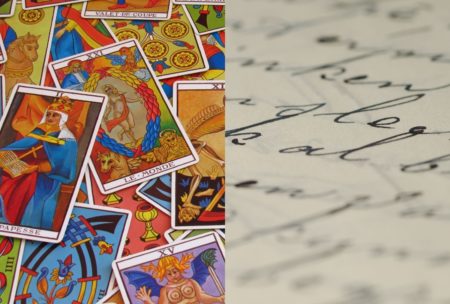 tarot cards and handwriting on white paper