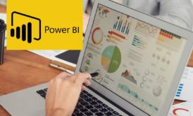power bi logo and person creating chart on laptop