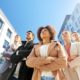 team of corporate people looking up the sky
