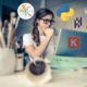 Woman sitting on desk and learning about data science through her laptop