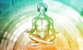 man sitting down meditating and listening to music