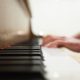 close up of person playing the piano