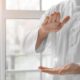 Hands of reiki practitioner wearing white