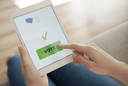 woman voting on ipad