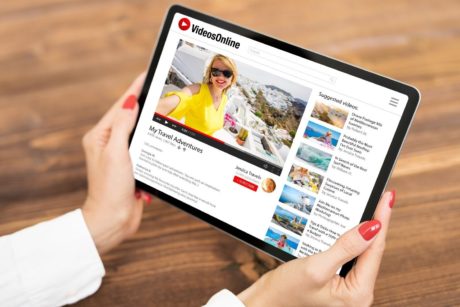woman opening you tube through tablet device