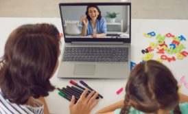 mother and daughter watching online video