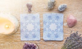 Tarot cards arranged on a wooden table for an angel card reading