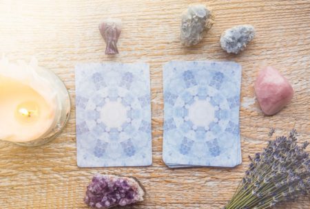 Tarot cards arranged on a wooden table for an angel card reading