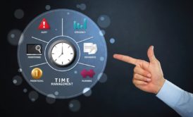 person pointing at time plan