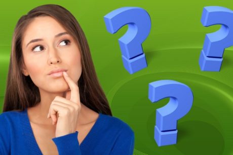 woman thinking blue question marks