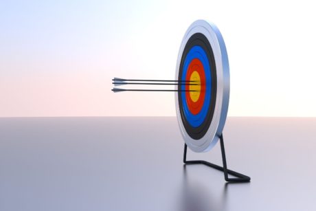 a set of arrows striking a target, symbolizing the importance to focus on your goals and achieve success