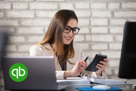 woman using quickbooks on desktop