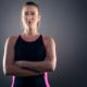 female sports athlete with hands folded