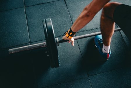 man bodybuilding in gym