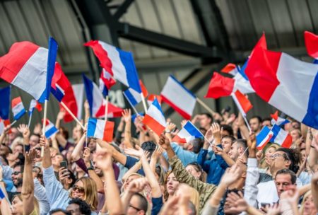 people waving french flag