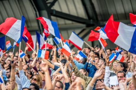 people waving french flag