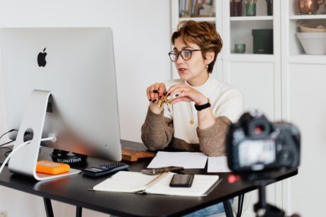 online teaching expert sitting on desk and using computer