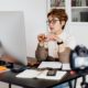 online teaching expert sitting on desk and using computer