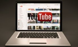 youtube on silver laptop