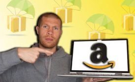 man holding laptop with amazon logo