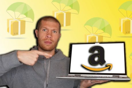 man holding laptop with amazon logo