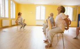 women doing chair yoga