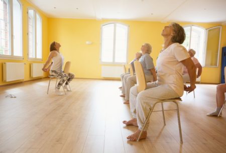 women doing chair yoga