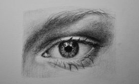 realistic eye drawn in pencil