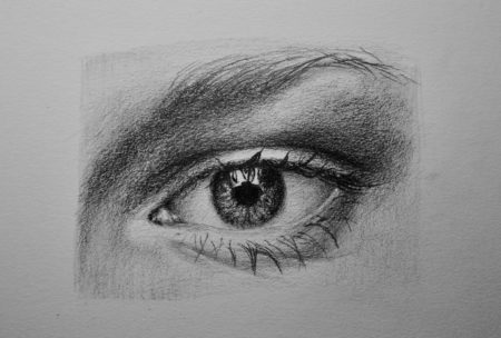 realistic eye drawn in pencil