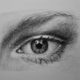 realistic eye drawn in pencil