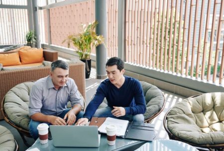 man showing pitch deck to investor