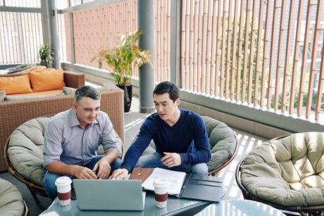 man showing pitch deck to investor