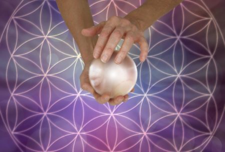 hands holding crystal ball
