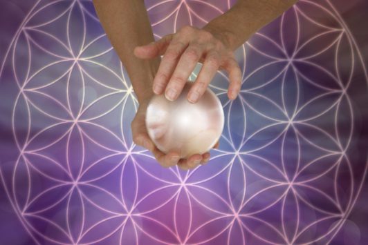 hands holding crystal ball
