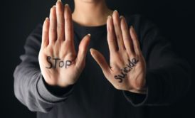 person stop suicide written on palms