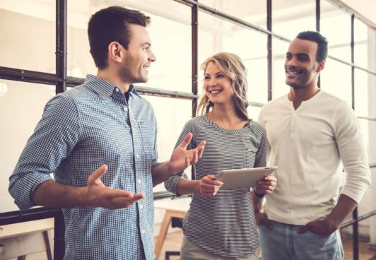 people talking to each other in the workplace