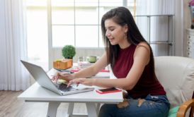 woman typing on laptop