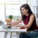 woman typing on laptop