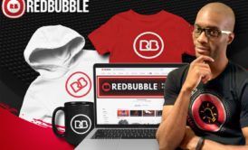a laptop displaying Redbubble course, surrounded by various clothing items like t-shirts and hoodies