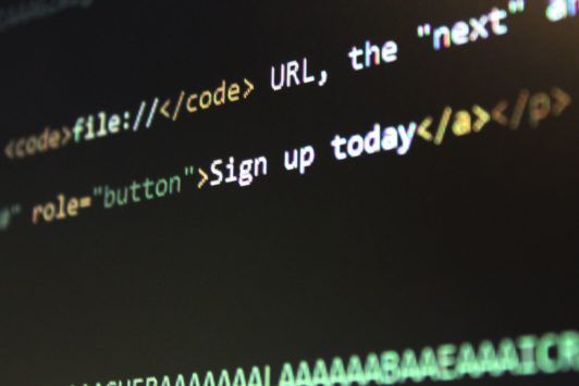 a computer screen displaying code written in HTML and HTML5 programming languages