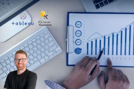 hand pointing at graphs and charts with inserted photo of man in glasses